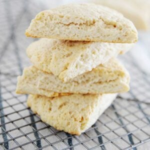 a stack of scones with cream