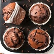 closeup of chocolate zucchini muffins in a muffin tin