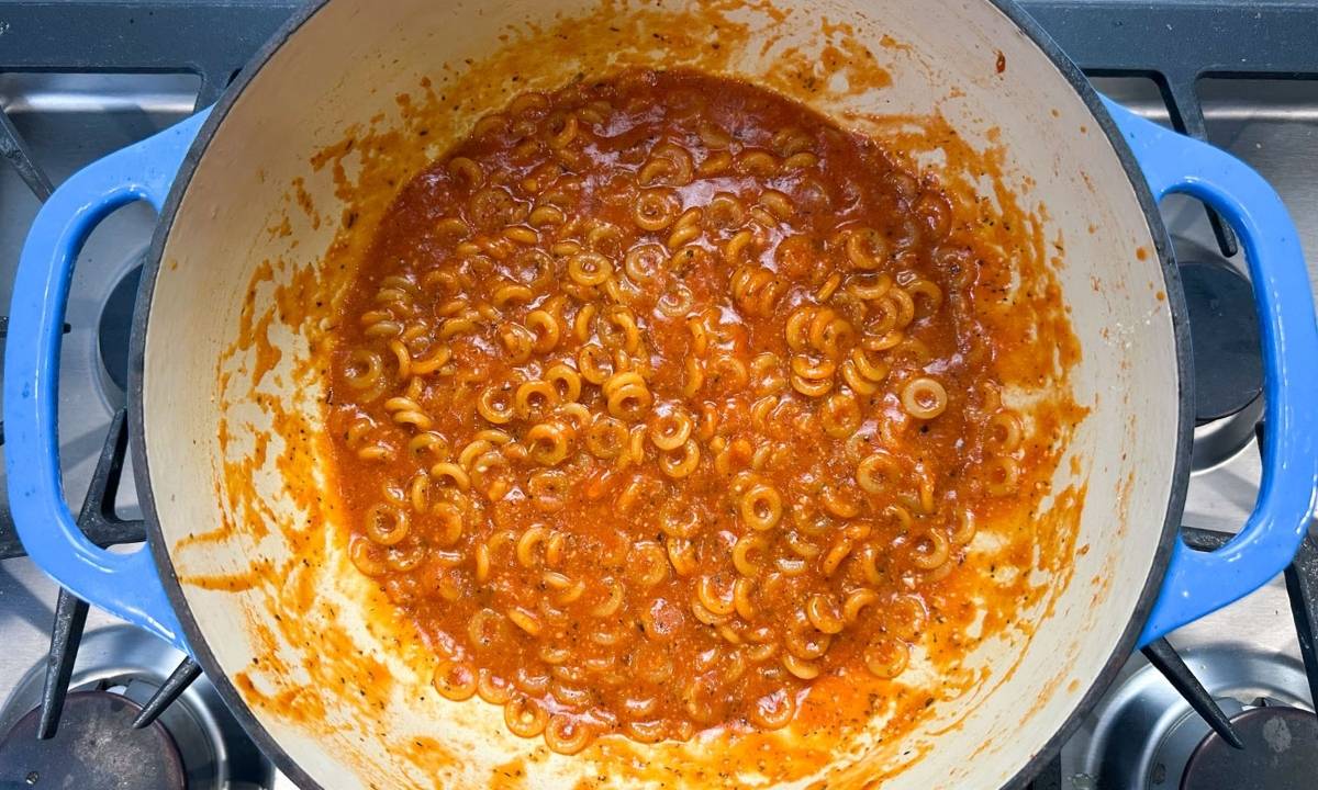 a pot on the stove with homemade spaghettios