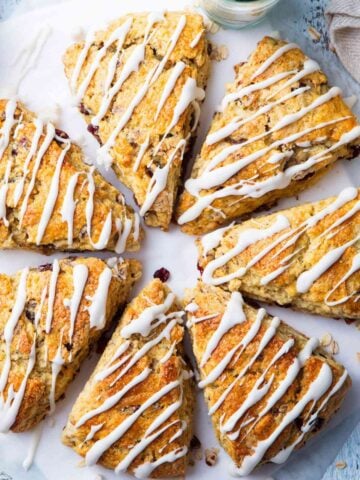 overhead view of cranberry orange scones on a wooden board
