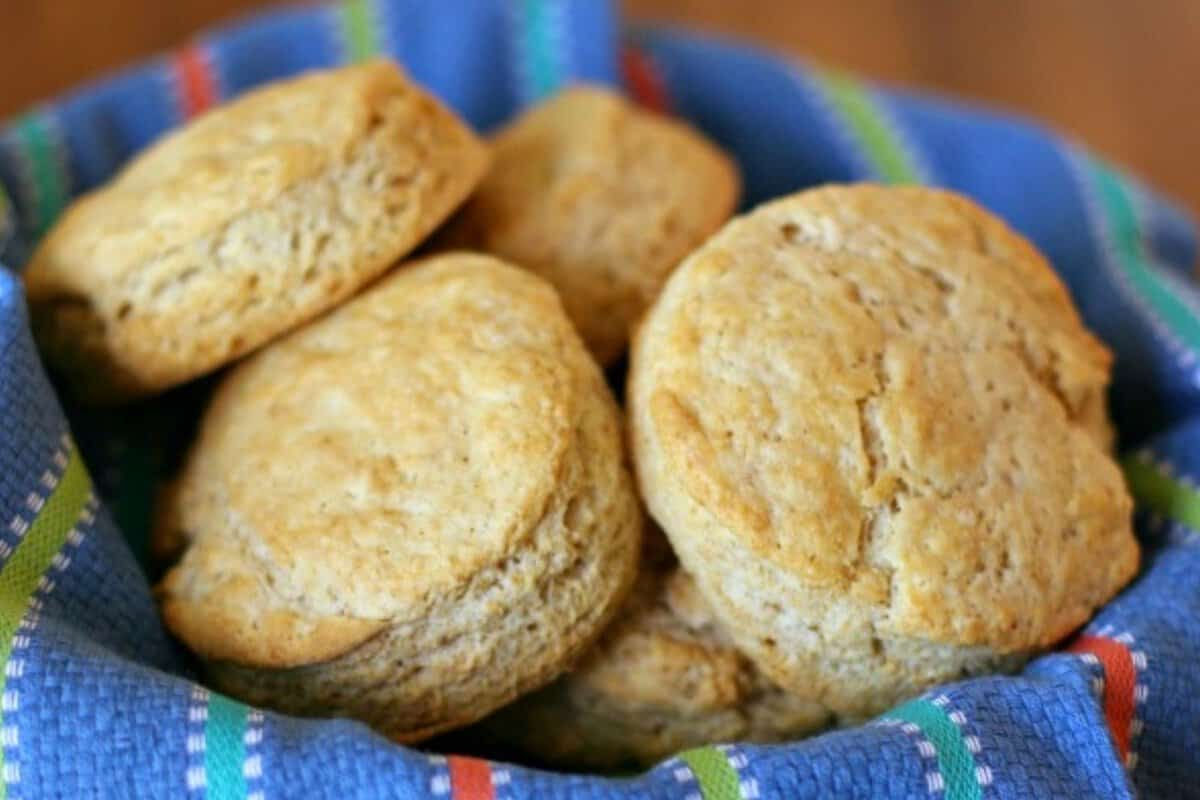 a basket of honey wheat biscuits