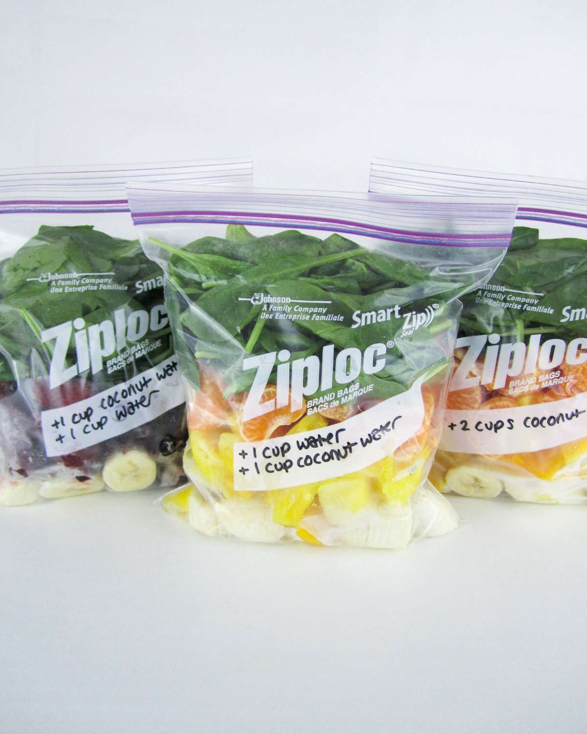 three zip bags with ingredients to make smoothies