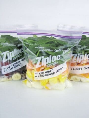 three zip bags with ingredients to make smoothies