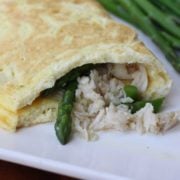 Crab and Asparagus Omelette on a plate with asparagus on the side