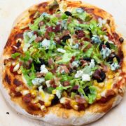 salad pizza on a cutting board