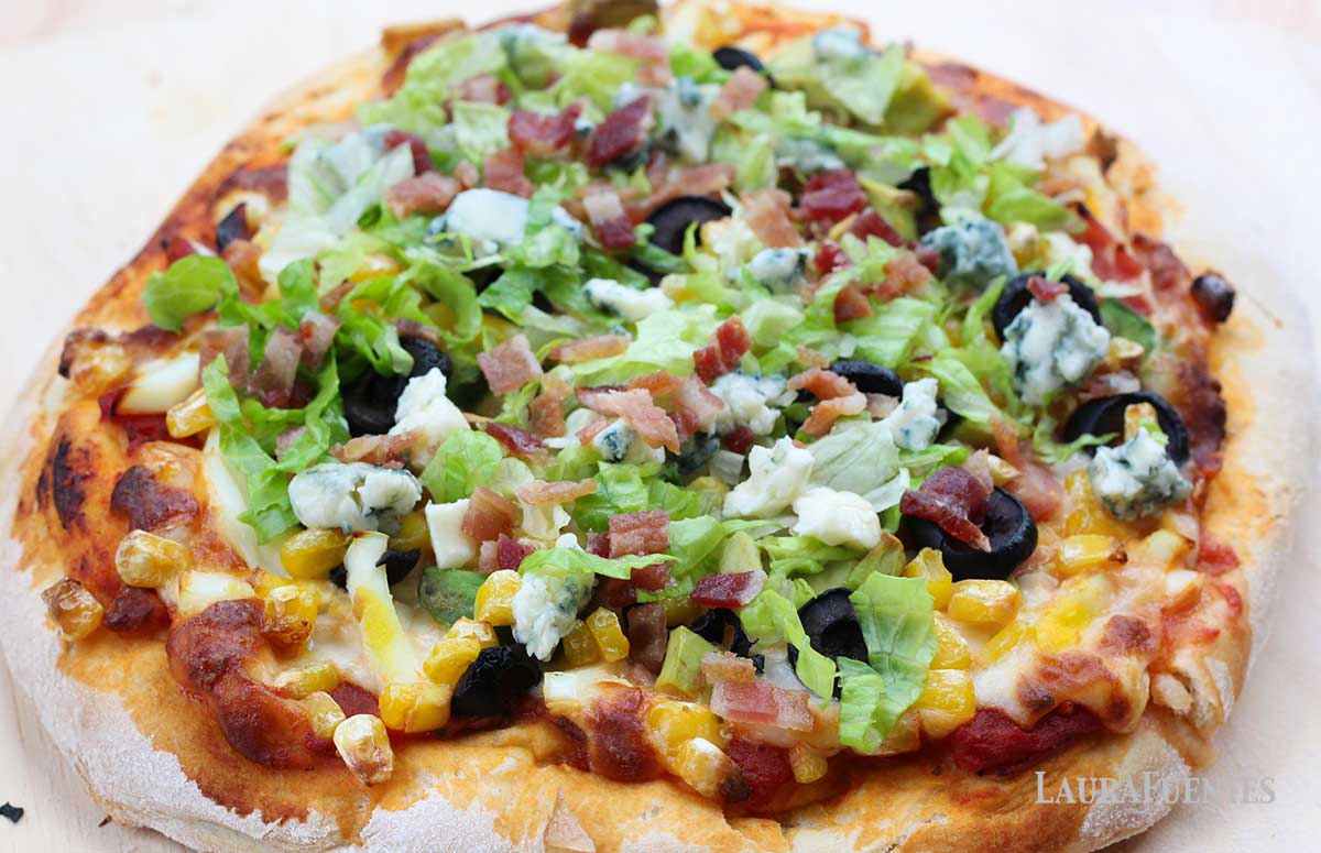 salad pizza on a cutting board