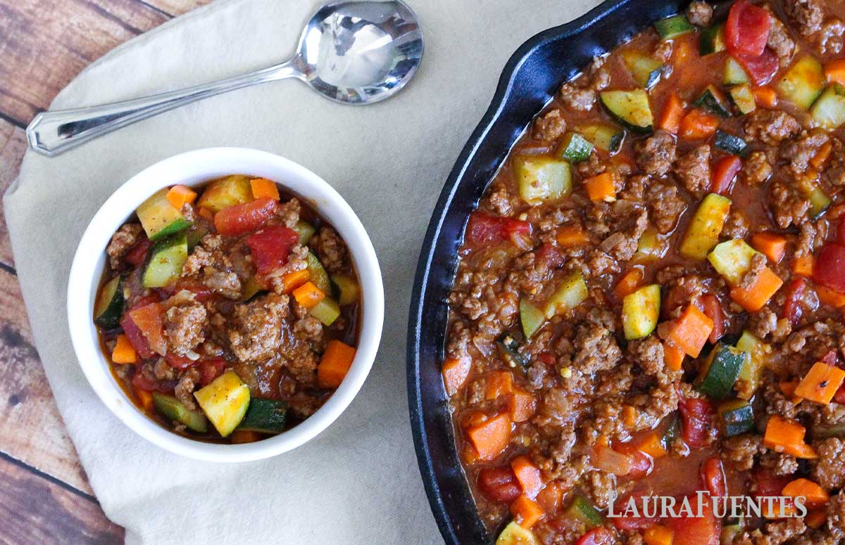 skillet of paleo chili next to small bowl of chili