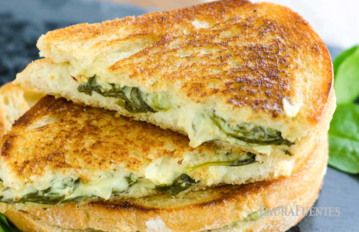 spinach and artichoke sandwich cut in half