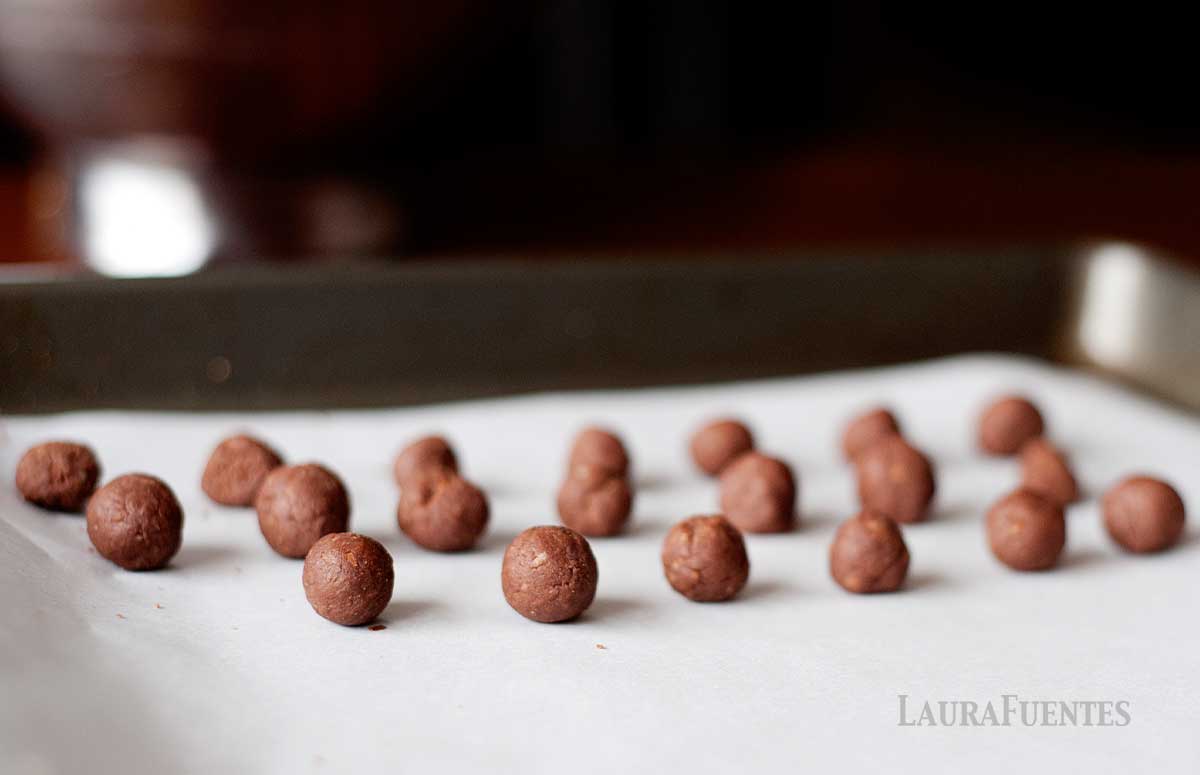 cocoa puffs on a baking sheet ready to be baked