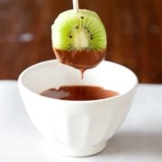 kiwi slices on popsicle sticks after dipped in chocolate