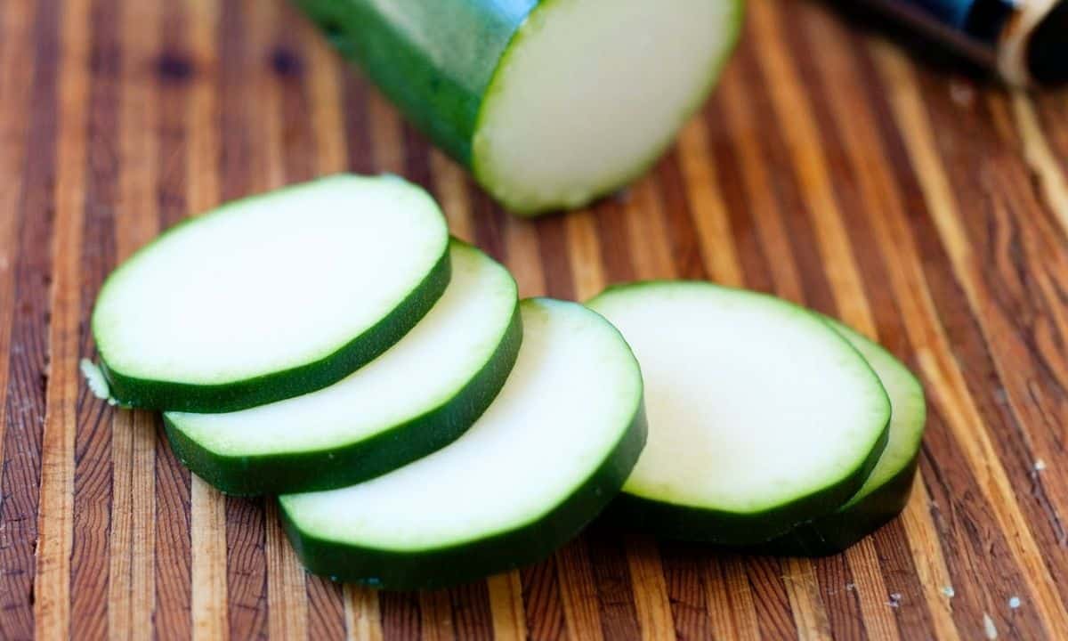 zucchini slices on a wooden board