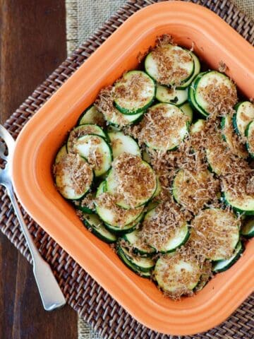 overhead view of zucchini au gratin in a baking dish