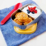 zesty mini quiches in a tin lunchbox with yoghurt and fruit on the side
