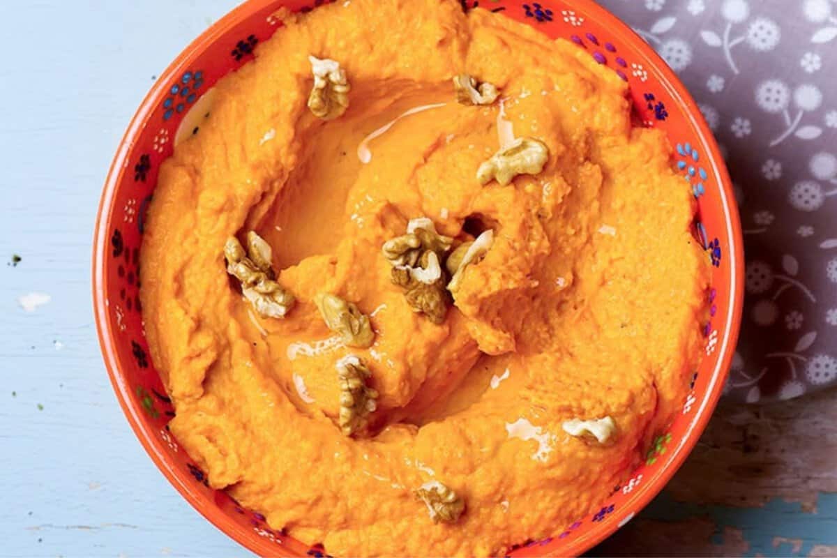 overhead view of a bowl of sweet potato hummus
