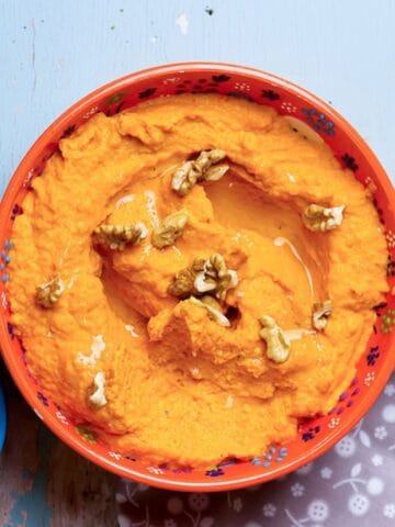 overhead view of a bowl of sweet potato hummus