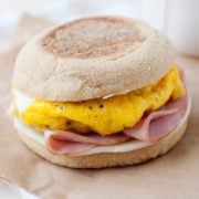an english muffin breakfast sandwich on a plate