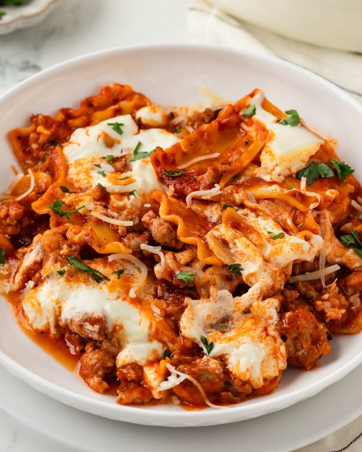 overhead view of a plated serving of a quick and easy lasagna made in a skillet from a one pot lasagna recipe