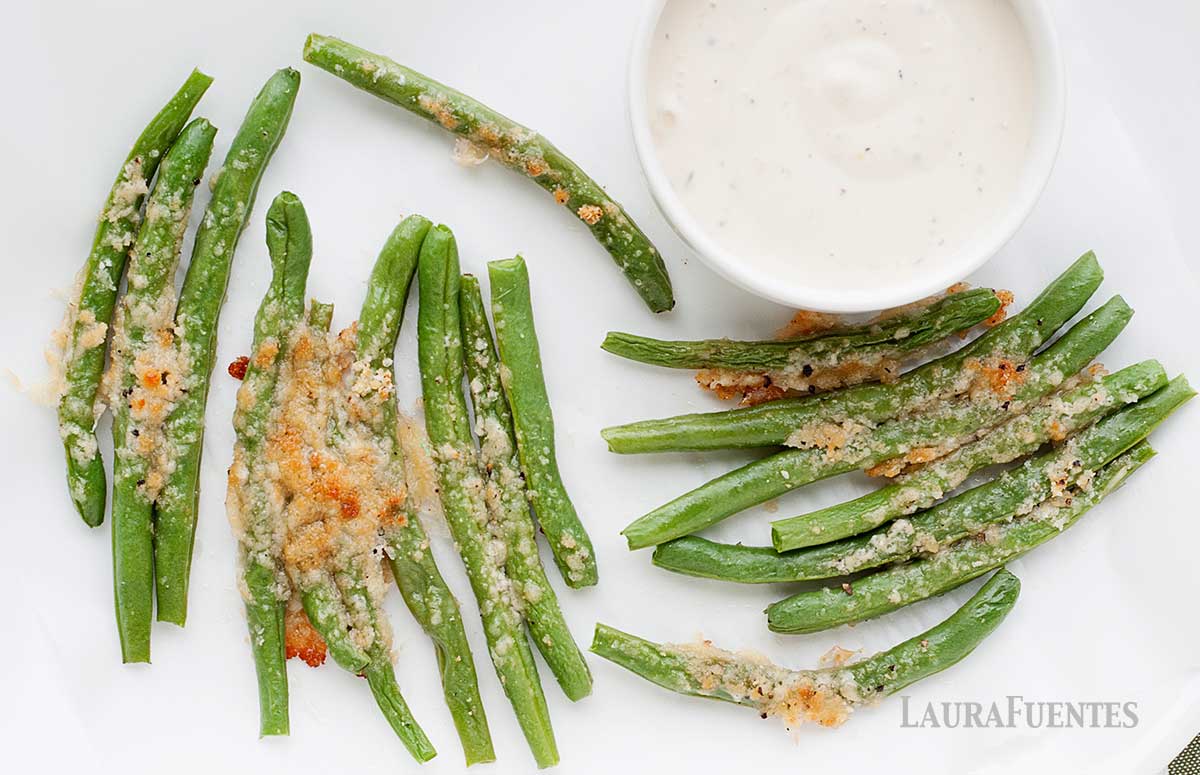 parmesan green bean fries on a plate with ranch dip on the side