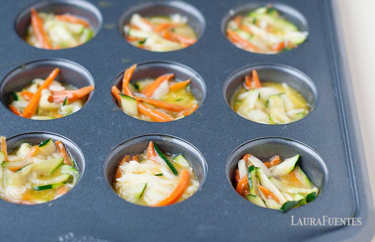 uncooked mini quiches in muffin pan