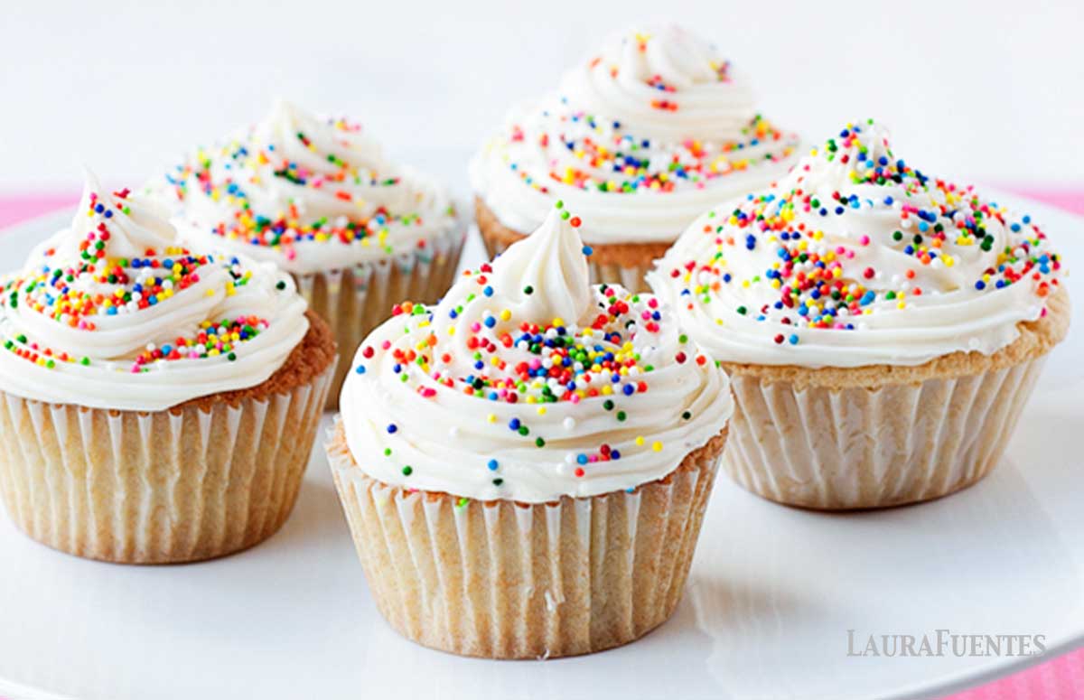 five birthday cupcakes on a white plate