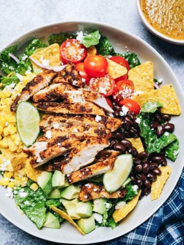 top view of a big plate with santa fe chicken salad with tomatoes, avocado, corn, and black beans