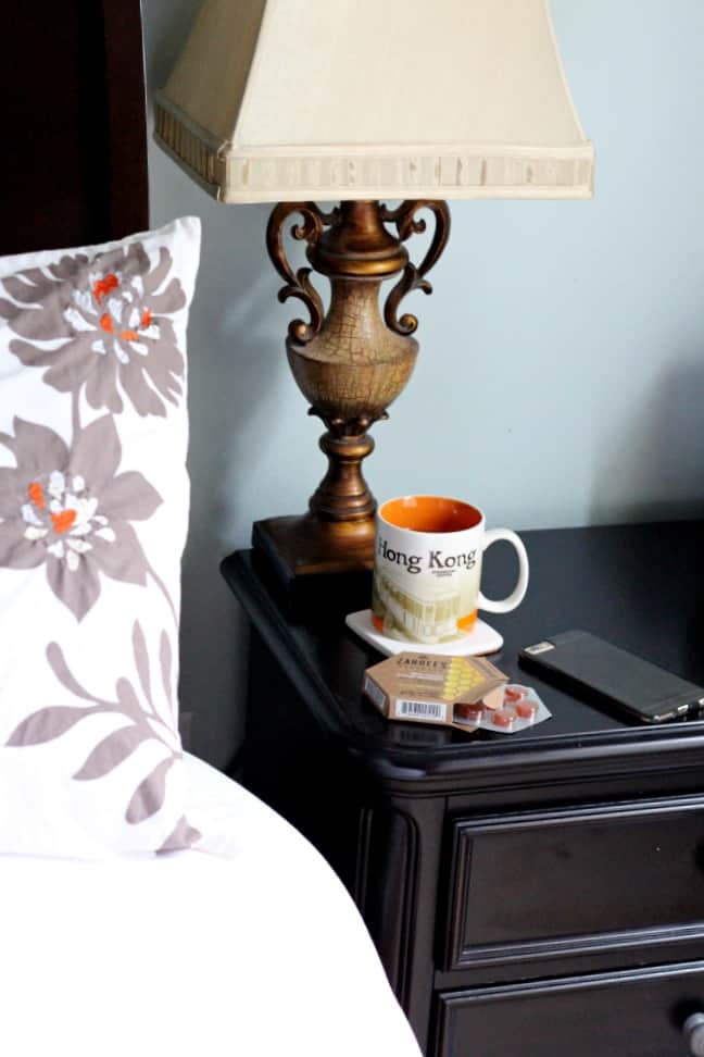 water, zarbees honey soothers on nightstand at night