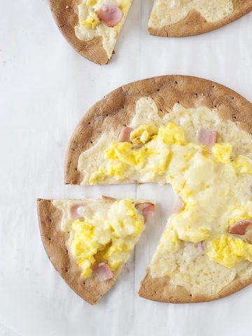Need a fun breakfast idea? These Ham, Egg, & Cheese Breakfast Pizzas are delicious and can be made gluten free!