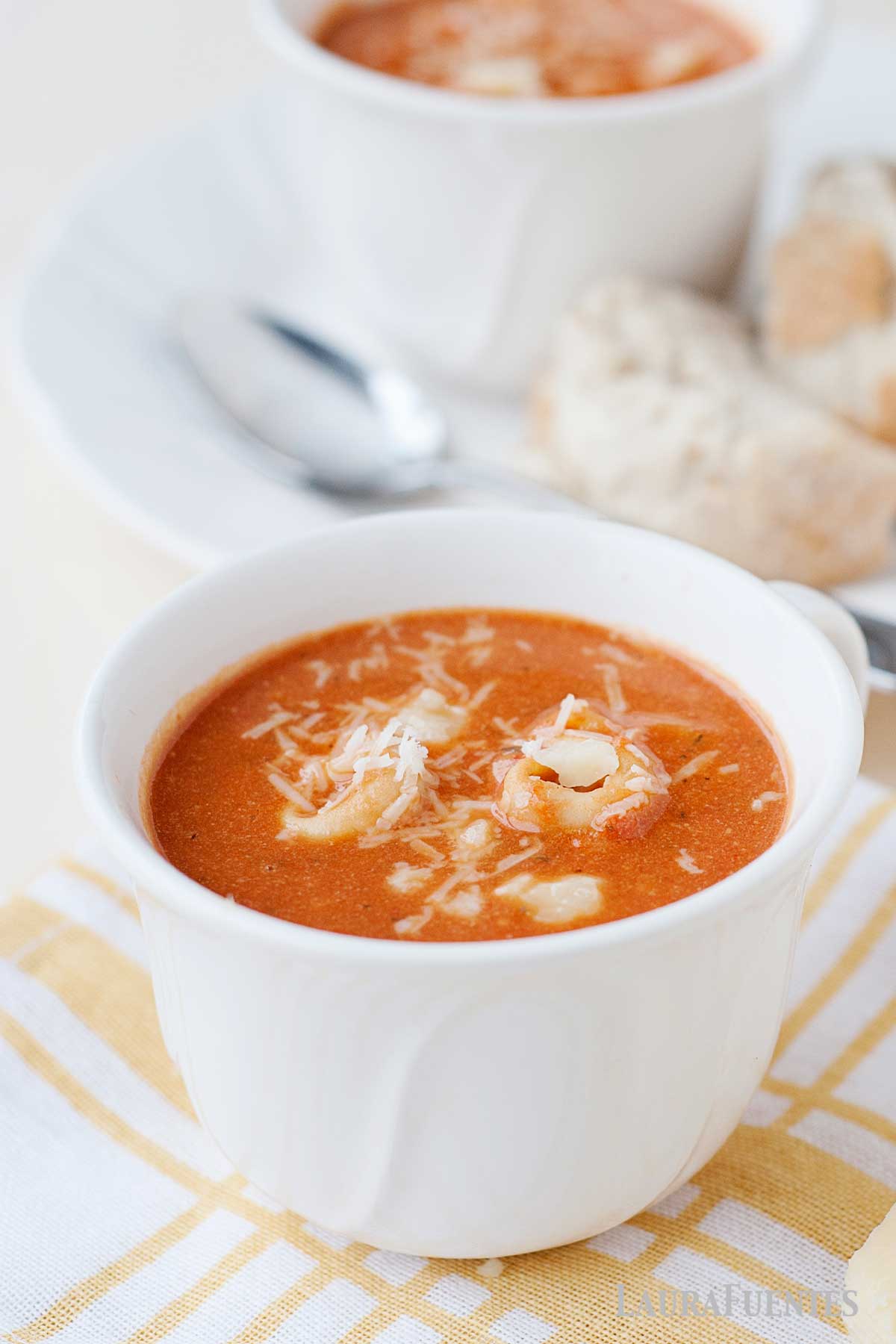 a cup of tomato tortellini soup