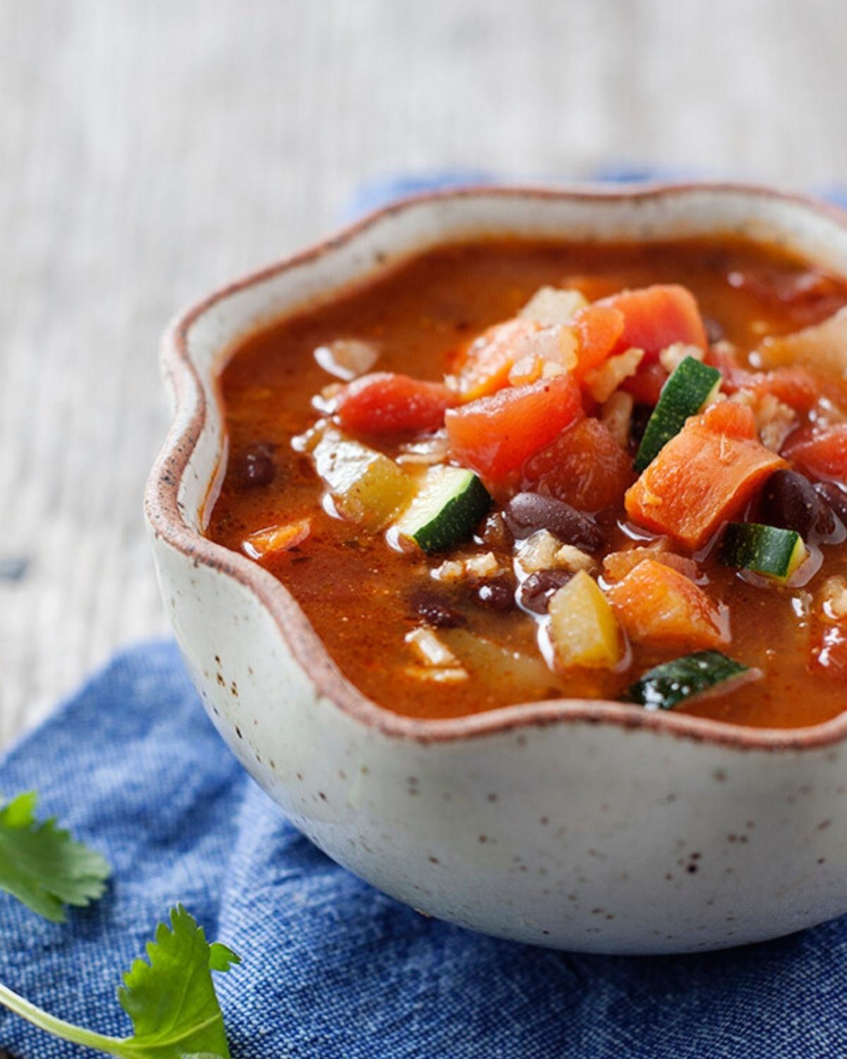a bowl of vegetable soup with beans