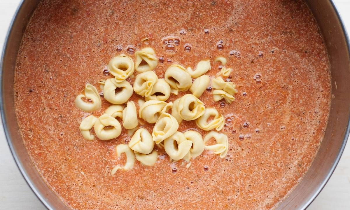 tortellini in a tomato soup pot