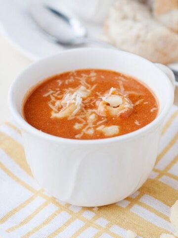 a cup of tomato tortellini soup