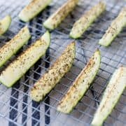 roasted zucchini spears in a cooling rack