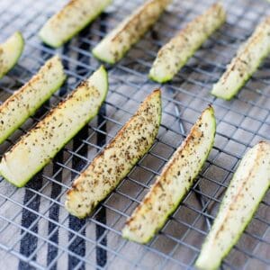 roasted zucchini spears in a cooling rack
