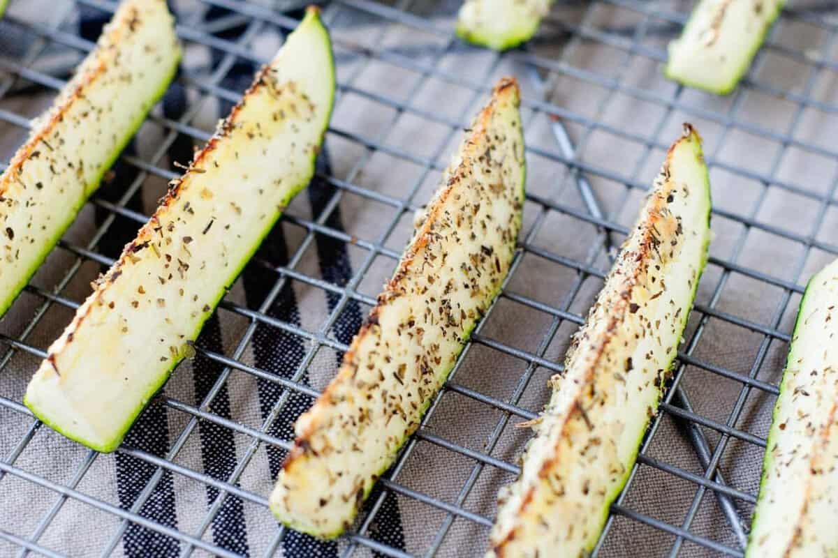 roasted zucchini spears in a cooling rack
