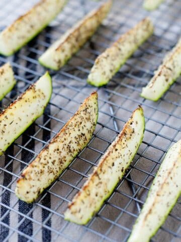 roasted zucchini spears in a cooling rack