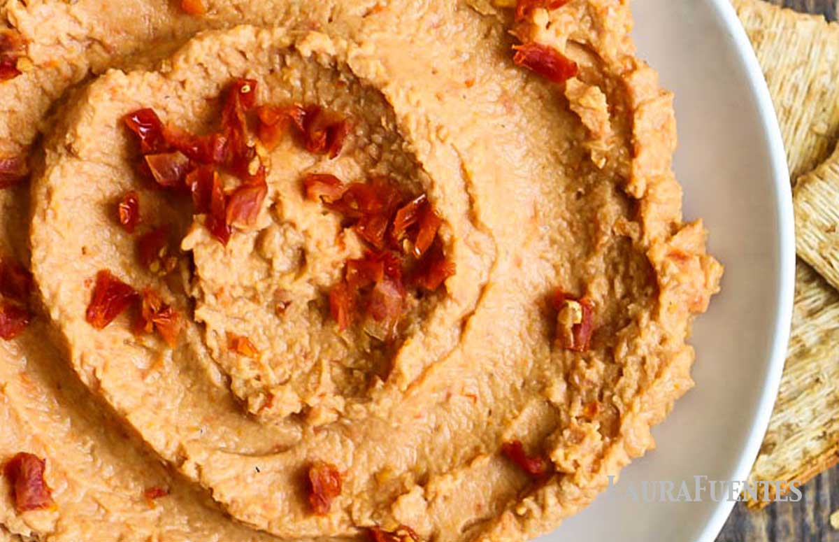closeup of large bowl of sun dried tomato hummus