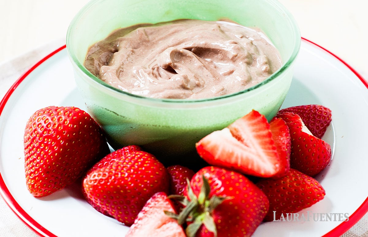 Chocolate Peanut Butter Yogurt Dip on a plate with strawberries on the side
