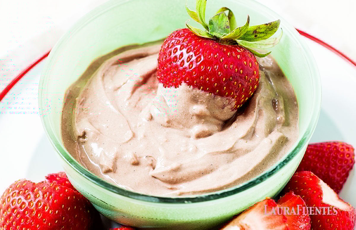 Chocolate Peanut Butter Yogurt Dip on a plate with strawberries on the side