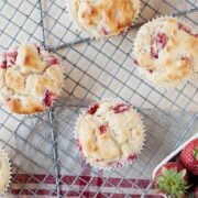 a few muffins on a cooling rack on the side
