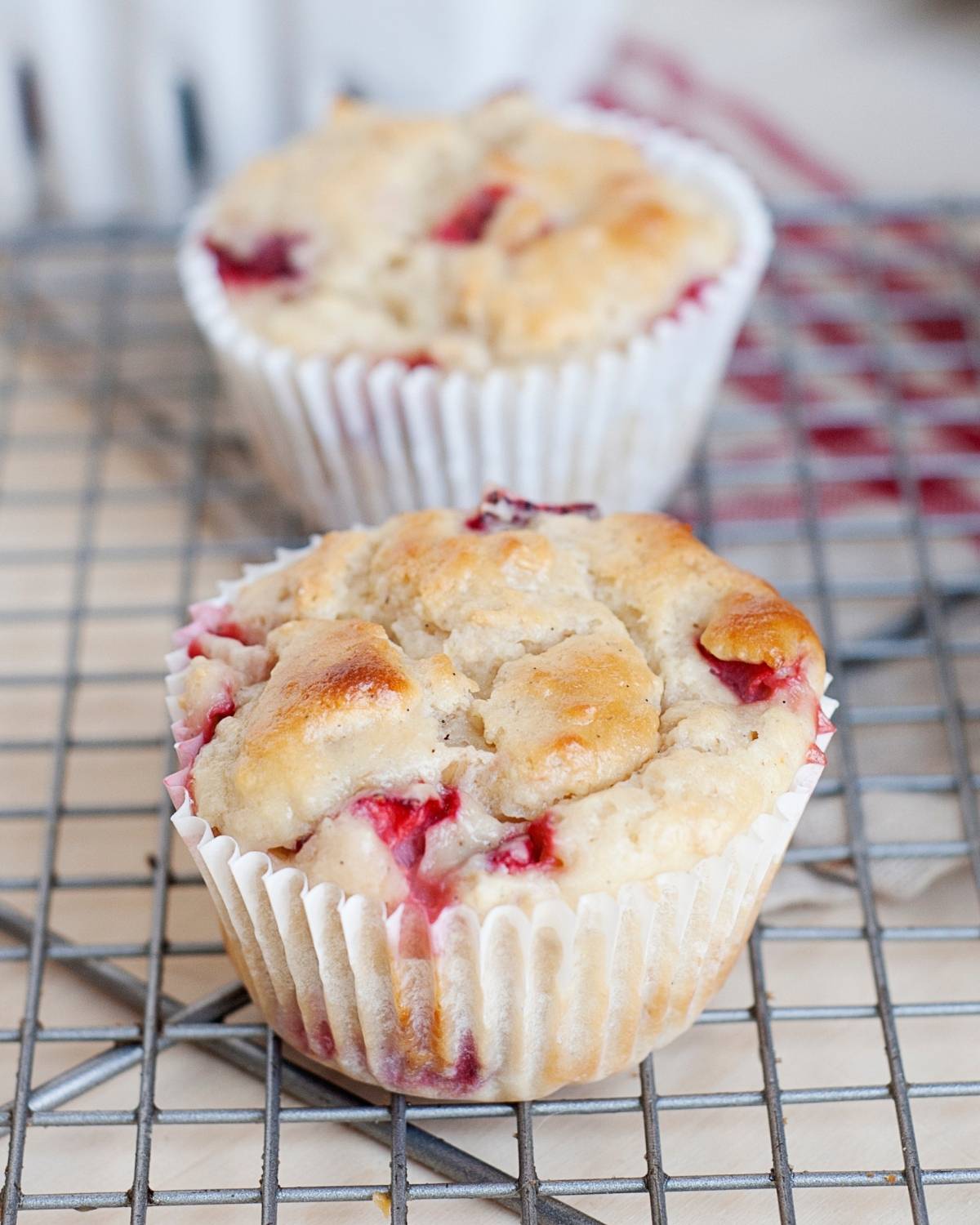 a few muffins on a cooling rack on the side