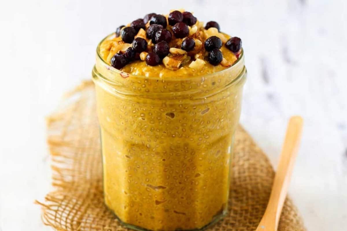 jar with pumpkin chia pudding topped with chocolate chips