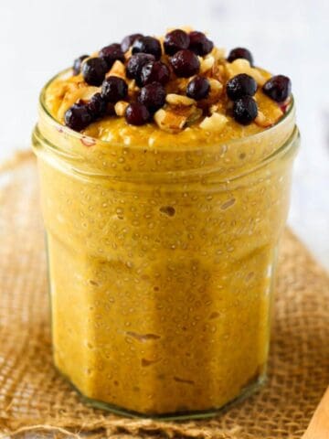 jar with pumpkin chia pudding topped with chocolate chips