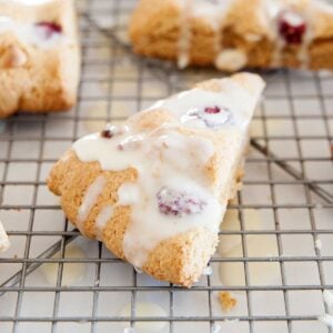 A Raspberry White Chocolate Chip Scone on a cooling rack