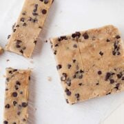six sliced no-bake blondies with chocolate chips. Freshly shaped from a loaf pan.