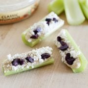 Hummus stuffed celery stalks on the kitchen counter