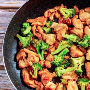 chicken and broccoli stir fry in a skillet