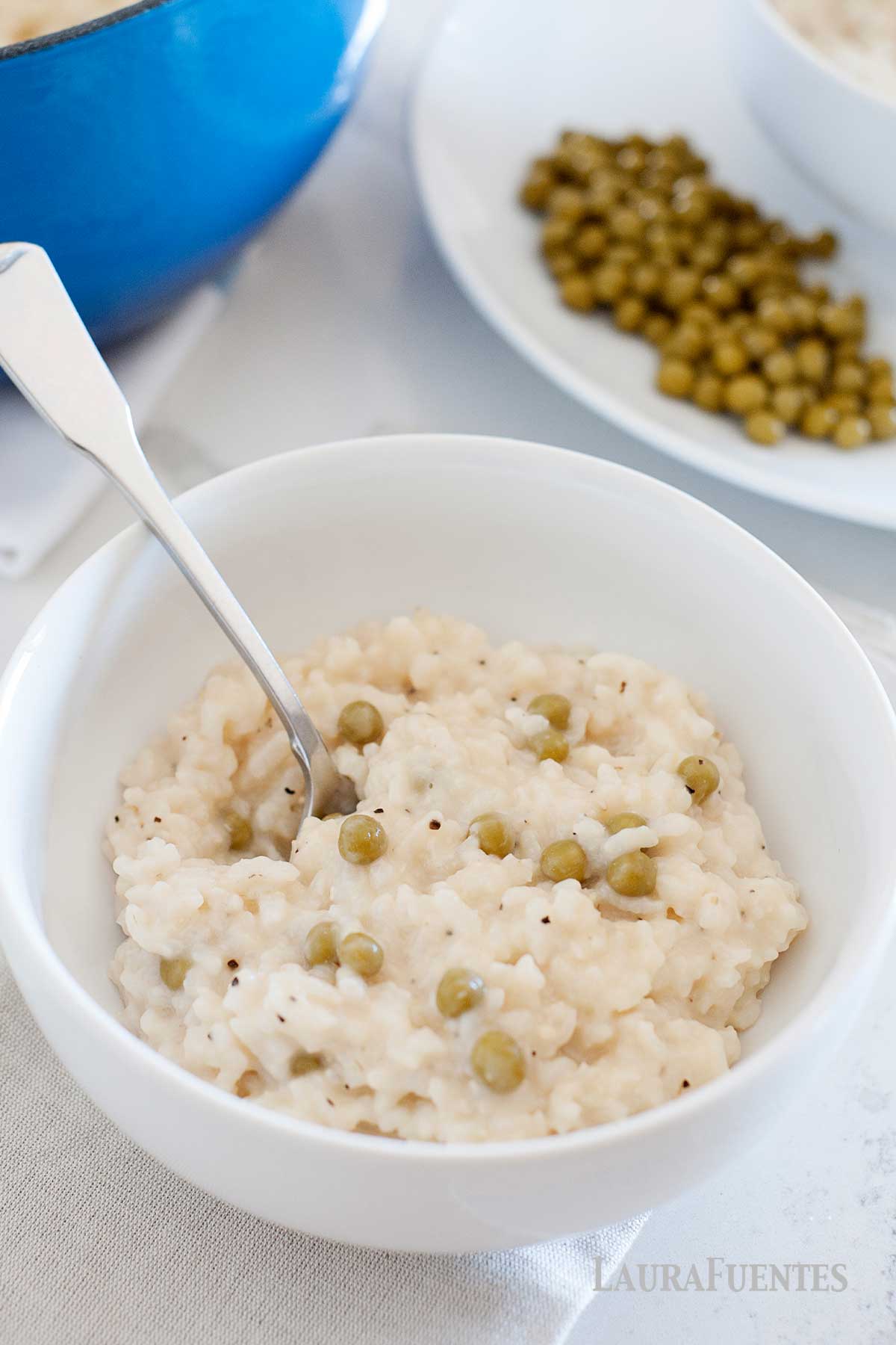a big bowl of risotto with parmesan and peas