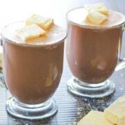 two transparent mug of protein hot chocolate with marshmallows
