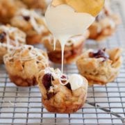 cranberry orange bread pudding bites with a spoon glazing them