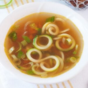 a bowl with zucchini ramen soup